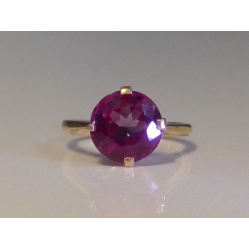 158 - An Alexandrite? Colour Change Gem Set Ring in a high carat precious yellow metal setting, 10.8mm sto... 