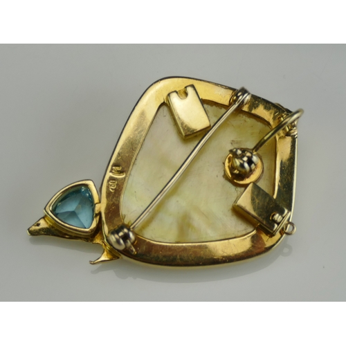 16 - A Modernist 18ct Gold, Blue Topaz and Mother of Pearl Brooch with Pendant Loop, 44mm high, stamped 7... 