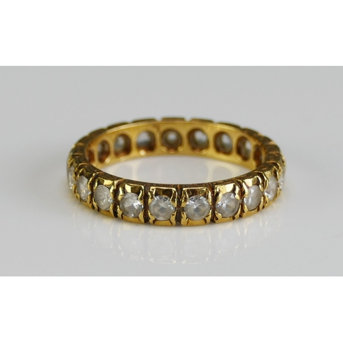 17 - An 18ct Gold and Synthetic Spinel Eternity Ring, 3.73mm wide, size M, stamped 18CT SYN SPIN, 3.41g