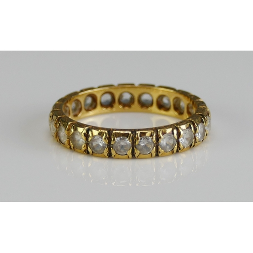 17 - An 18ct Gold and Synthetic Spinel Eternity Ring, 3.73mm wide, size M, stamped 18CT SYN SPIN, 3.41g