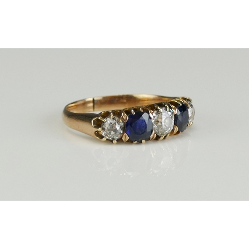 186 - A Sapphire and Diamond Five Stone Ring in a high carat precious yellow metal setting, early 20th cen... 