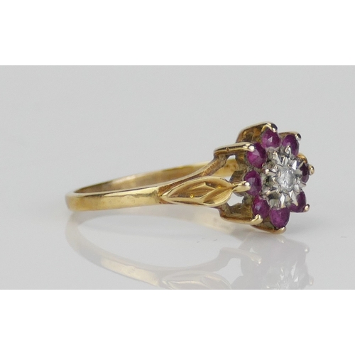 261 - A 9ct Gold, Ruby and Diamond Cluster Ring, size M.5, hallmarked, 1.7g