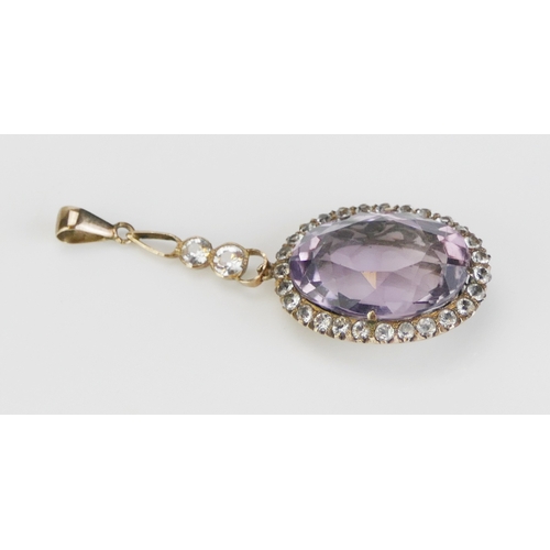 266 - An Antique Amethyst and Gem Set Pendant in a precious yellow metal setting, c. 47.6mm drop, 5.58g