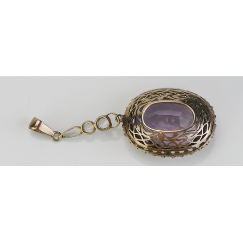 266 - An Antique Amethyst and Gem Set Pendant in a precious yellow metal setting, c. 47.6mm drop, 5.58g