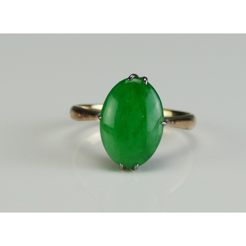 28 - A Chinese 18K Gold and Jadeite Ring, 12.9x9mm stone, size L, stamped 18 and with Chinese characters,... 