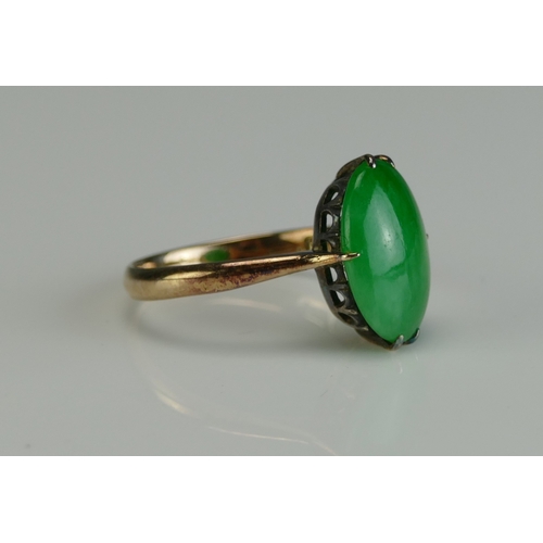 28 - A Chinese 18K Gold and Jadeite Ring, 12.9x9mm stone, size L, stamped 18 and with Chinese characters,... 