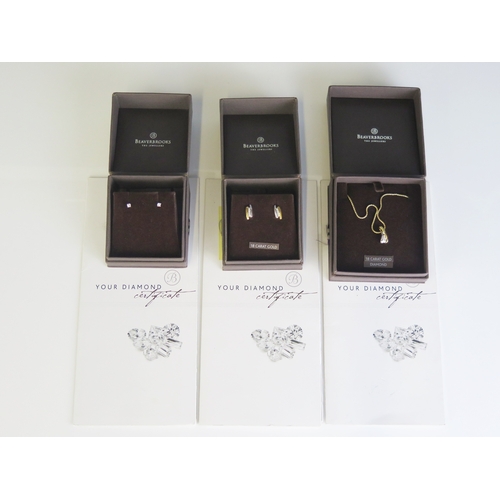 305 - Beaverbrooks, a diamond pendant and chain, a pair of diamond ear studs and two coloured gold and dia... 