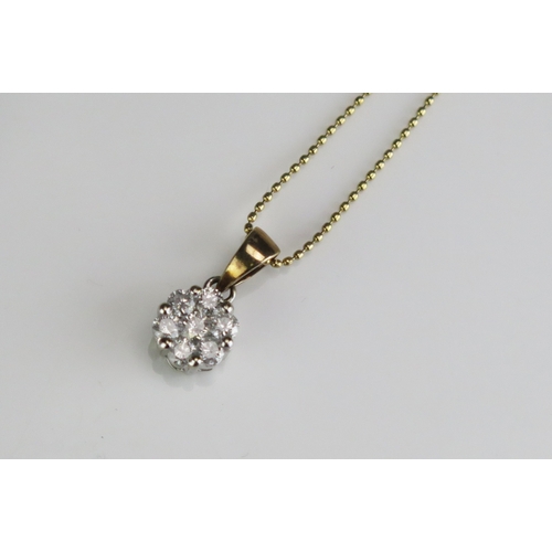 307 - An 18ct gold diamond cluster pendant, on 18ct gold chain, length of chain 222mm.