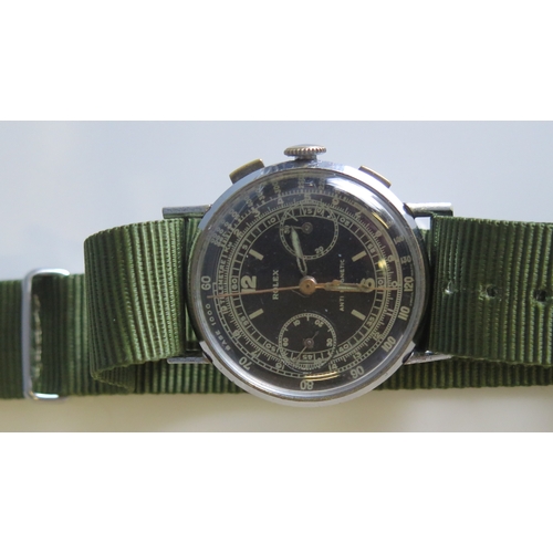 309 - A Military style stainless steel chronograph, the 30mm dial signed Rolex, with subsidiary second and... 