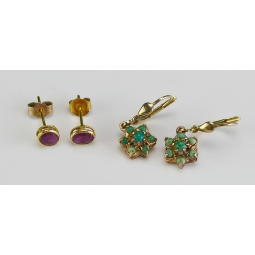 35 - A Pair of 18ct Gold and Ruby Stud Earrings (c. 5.5x4.6mm rub over set stones, one butterfly stamped ... 