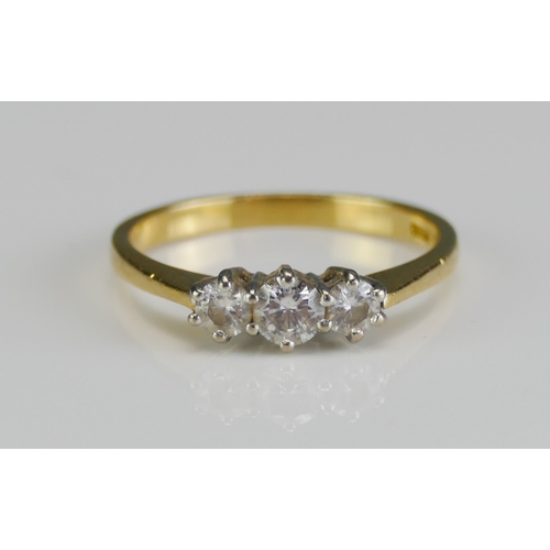 38 - An 18ct Gold and Diamond Three Stone Ring, c. 3.98mm principal brilliant round cut with 3.2mm should... 