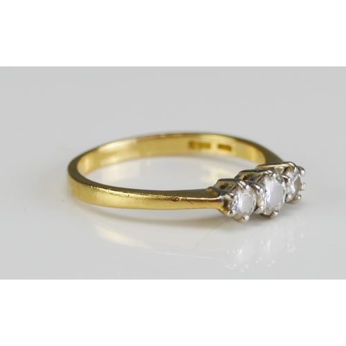 38 - An 18ct Gold and Diamond Three Stone Ring, c. 3.98mm principal brilliant round cut with 3.2mm should... 