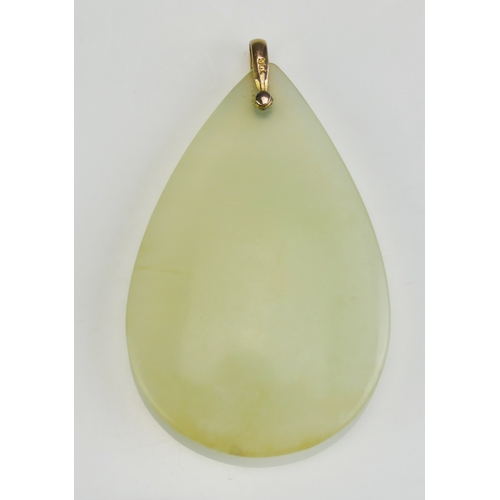 42 - A 9ct Gold Mounted Pale Jade Pendant, 62.4mm drop, stamped 9ct, 21.28g