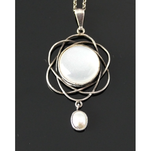 43 - An Arts & Crafts Moonstone and Blister Pearl Pendant in a precious white metal setting (47.6mm drop)... 