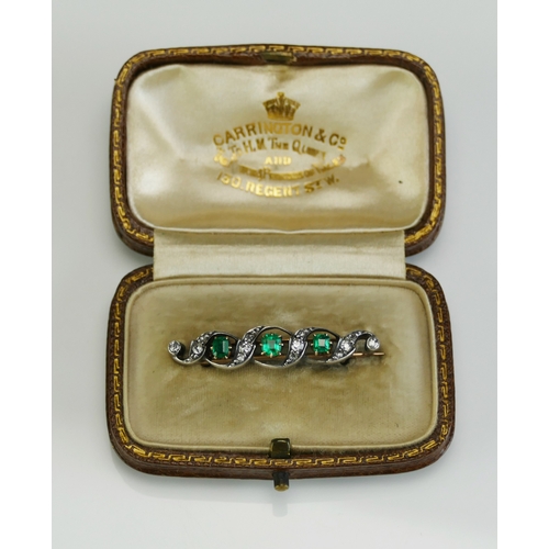 5 - A Cased Old Cut Diamond and Emerald Set Brooch in a precious yellow metal setting, 37.1mm wide, 3.86... 