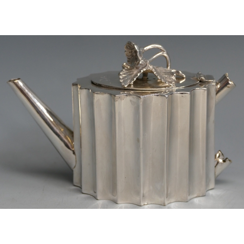 503 - A Victorian silver bachelors teapot, maker William Comyns & Sons, London, 1867, of oval fluted form,... 