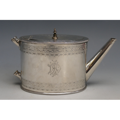 507 - A Victorian silver teapot, maker Robert Harper, London, 1868, monogrammed, of oval outline with chas... 