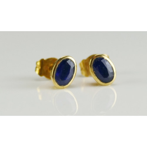 51 - A Pair of Sapphire Stud Earrings in high carat precious yellow metal settings, KEE tests as 18ct, 1.... 