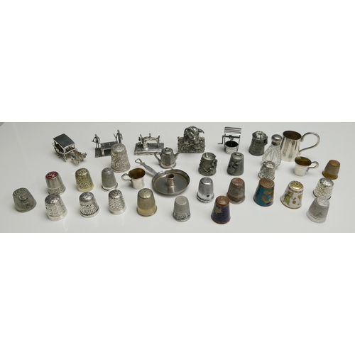 510 - A collection of silver and plated thimbles, white metal model of billiards players, pig, oxen drawn ... 