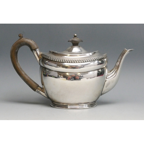 517 - An Edward VII silver bachelors teapot, maker Atkin Brothers, Sheffield, 1904, of oval form, raised o... 