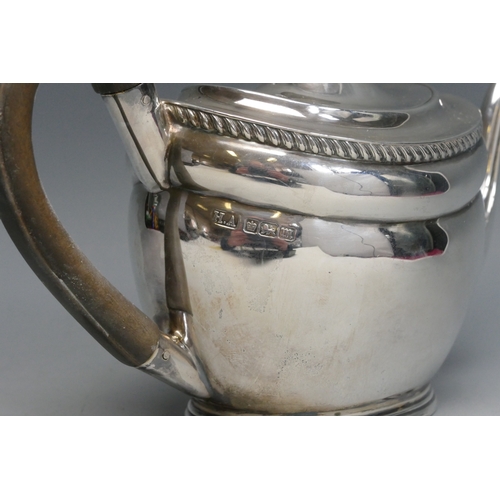 517 - An Edward VII silver bachelors teapot, maker Atkin Brothers, Sheffield, 1904, of oval form, raised o... 