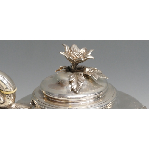 518 - A William IV silver teapot, maker's mark worn, London, 1834, of circular tapering form, with flowerh... 