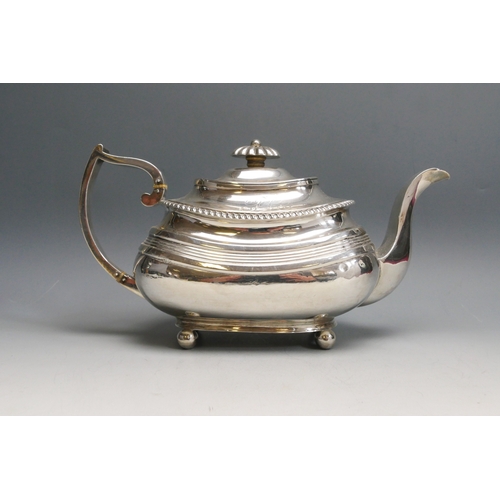 519 - A 19th century silver teapot, all marks worn, Exeter, initialled, of barge-shaped outline, raised on... 