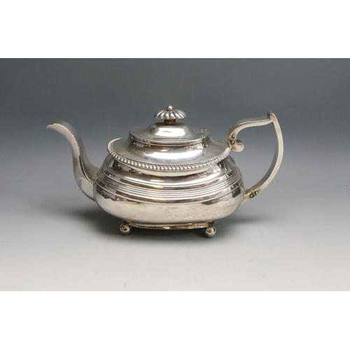 519 - A 19th century silver teapot, all marks worn, Exeter, initialled, of barge-shaped outline, raised on... 