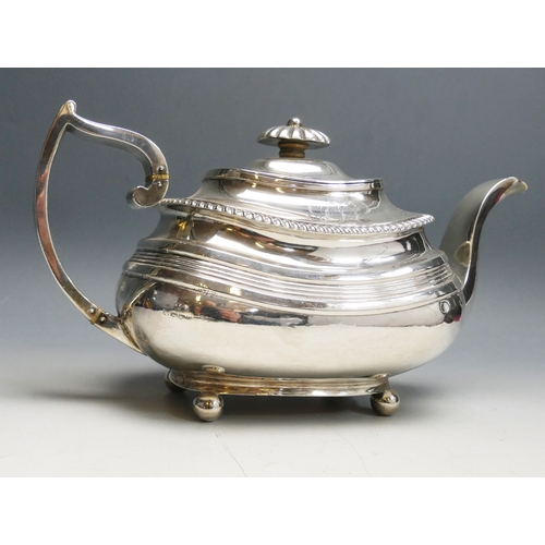 519 - A 19th century silver teapot, all marks worn, Exeter, initialled, of barge-shaped outline, raised on... 