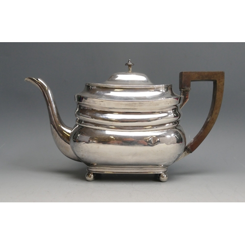 521 - A George III silver teapot, maker Thomas Robins, London, 1806, crested, of barge-shaped outline, rai... 