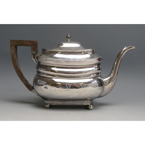 521 - A George III silver teapot, maker Thomas Robins, London, 1806, crested, of barge-shaped outline, rai... 