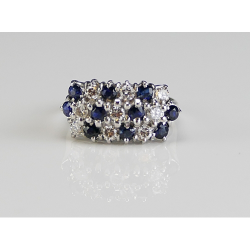 59 - An 18ct White Gold, Sapphire and Diamond Ring, 18.65x9.8mm head, size J, hallmarked, 5.28g