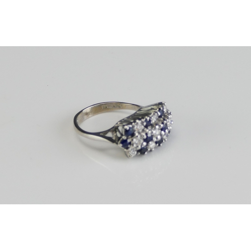 59 - An 18ct White Gold, Sapphire and Diamond Ring, 18.65x9.8mm head, size J, hallmarked, 5.28g