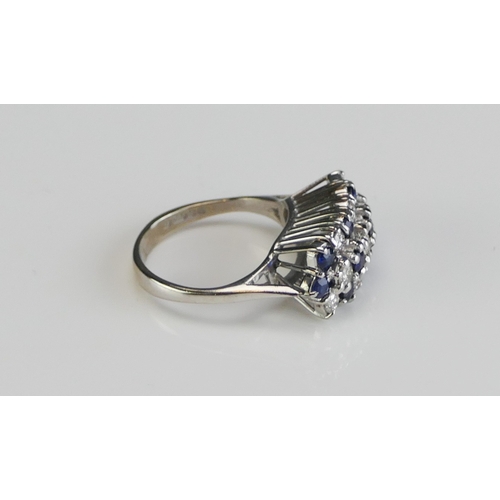 59 - An 18ct White Gold, Sapphire and Diamond Ring, 18.65x9.8mm head, size J, hallmarked, 5.28g