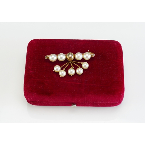 67 - An 'Oriental Pearl' 14K Gold and Cultured Pearl Brooch in original box, 48mm wide, stamped 14K, 9.63... 