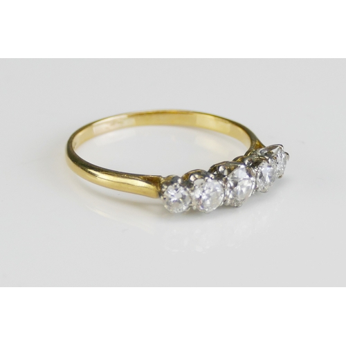 69 - An 18ct Gold and Diamond Five Stone Ring, 4.4mm principal stone with 3.5 and 2.95mm, size R.5, stamp... 