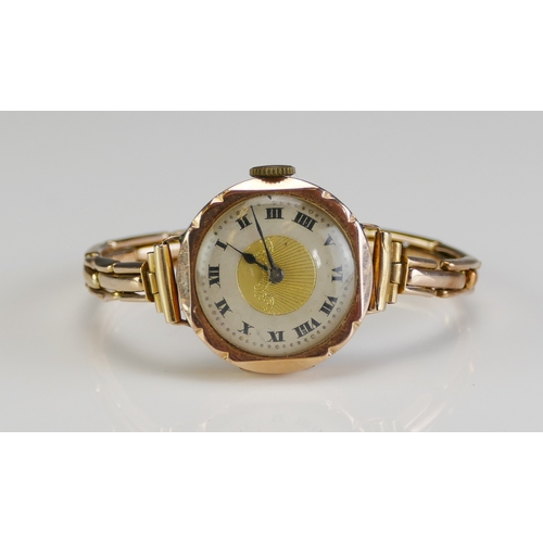 82 - A 9ct Gold Ladies Wristwatch on a 9ct gold bracelet, 15 jewel Swiss manual wind movement, 17.43g gro... 