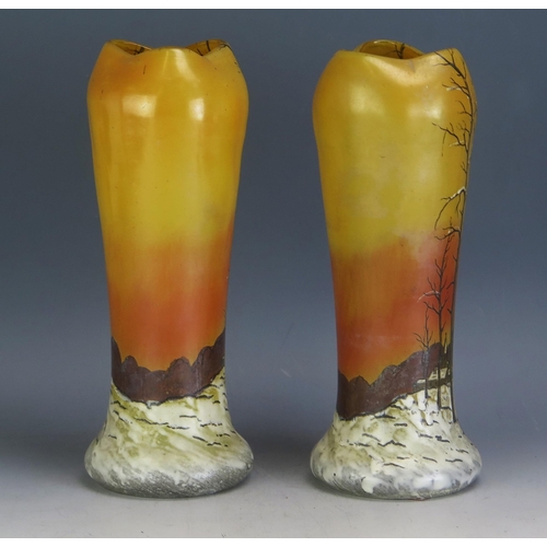 1728 - A pair of late Victorian orange glass vases decorated with a winter scene, 28cm high.