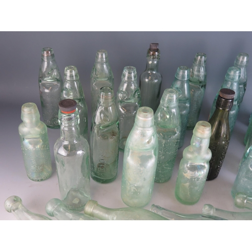 1732 - A collection of glass lemonade and other bottles, various shapes and designs.