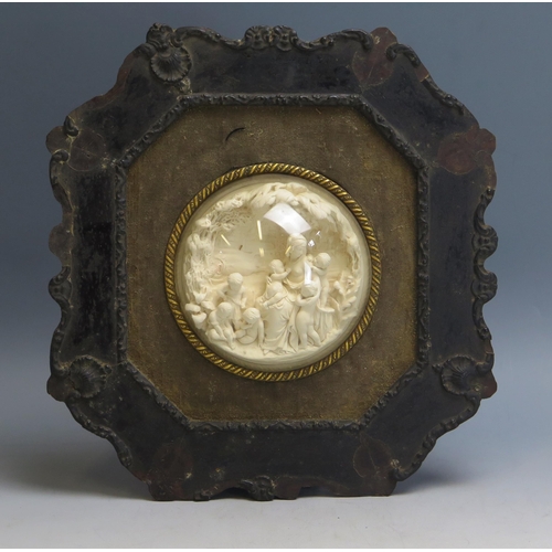 1734 - A 19th century low relief carved meerschaum circular panel depicting a neo-classical female surround... 