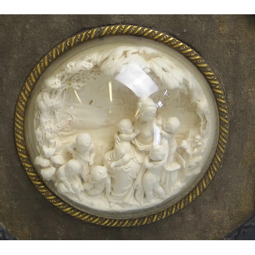 1734 - A 19th century low relief carved meerschaum circular panel depicting a neo-classical female surround... 