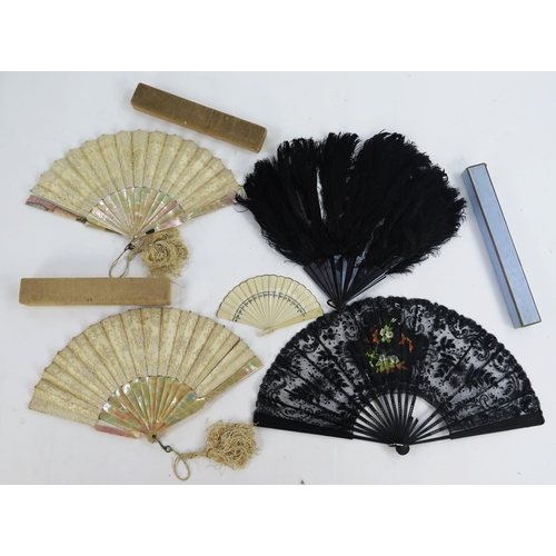 1735 - Four assorted early 20th century fans, two with mother-of-pearl sticks and guards, a celluloid fan a... 