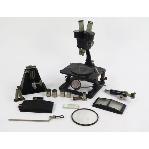 1736 - A Zeiss black enamel binocular microscope, with rack and pinion focussing, rectangular stage, plano/... 