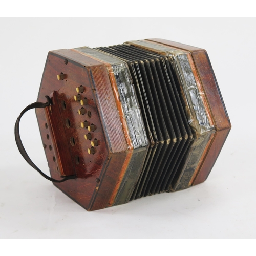 1737 - A late Victorian squeeze box of hexagonal form with paper bellows, and twenty ivorine buttons. a/f.