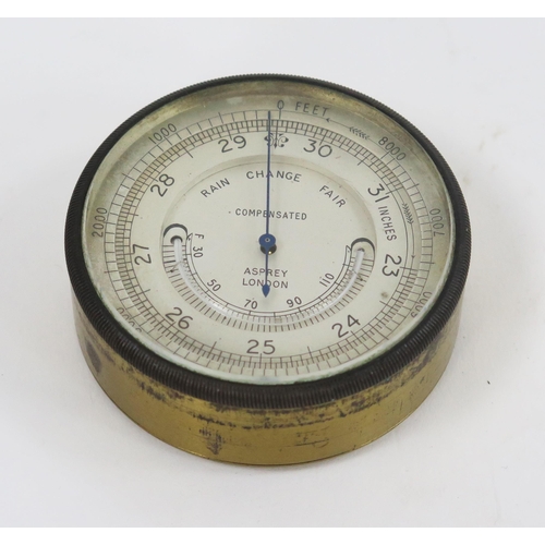 1741 - Asprey, London, a gilt brass pocket barometer and thermometer, with 5.5cm silvered dial, signed Aspr... 