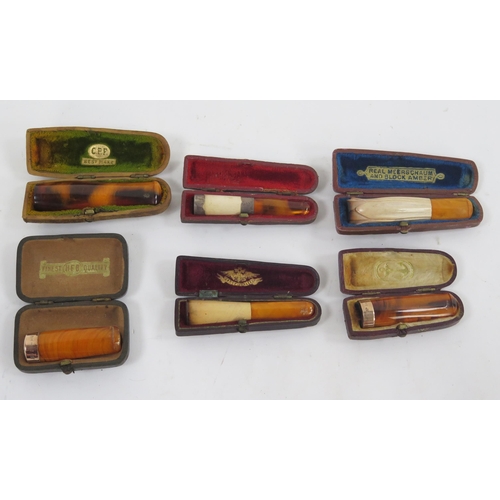 1744 - Two 9ct Gold Mounted Cheroot Holders, One silver Mounted and 3 others in Morocco leather cheroot hol... 