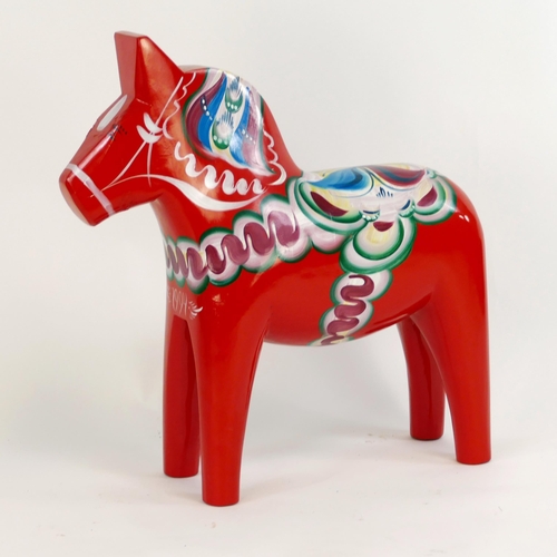 1775B - A Nils Olsen polychrome decorated Dala horse, dated 1994, with makers label