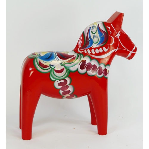 1775B - A Nils Olsen polychrome decorated Dala horse, dated 1994, with makers label