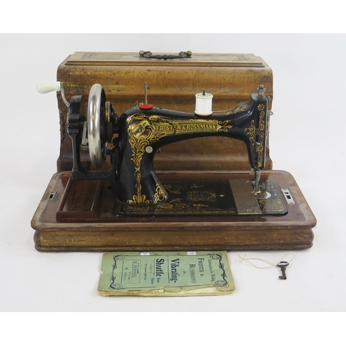 1776 - A Frister & Rossmann sewing machine, with gilt transfer print decoration, together with instruction ... 