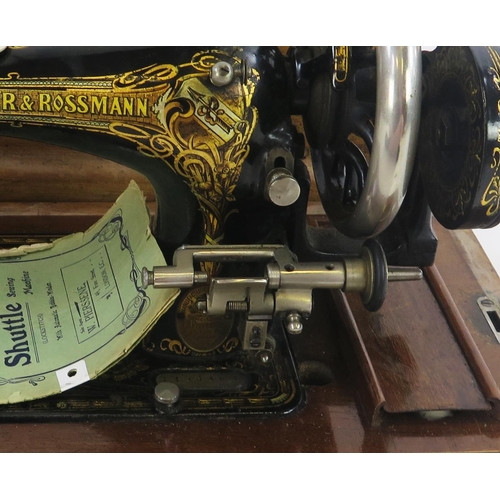 1776 - A Frister & Rossmann sewing machine, with gilt transfer print decoration, together with instruction ... 